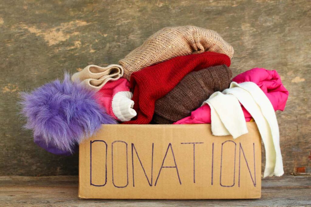 A donation box full of warm winter clothes