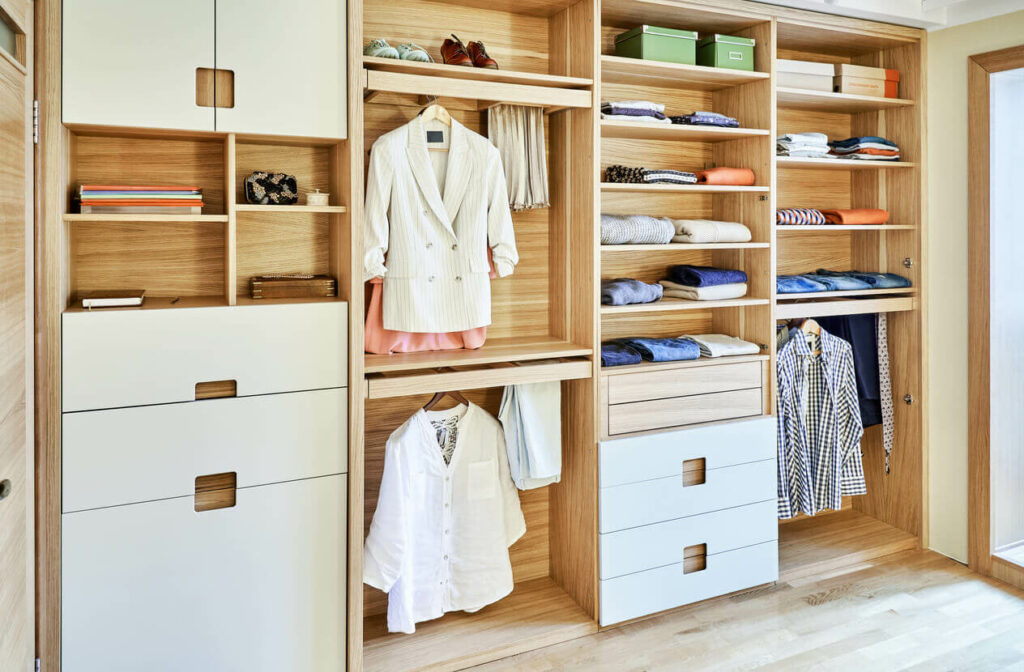 An organized closet with everything put away or hung up.