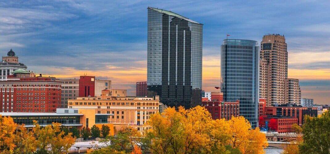 Grand Rapids, Michigan, in the fall with trees and skyscrapers.