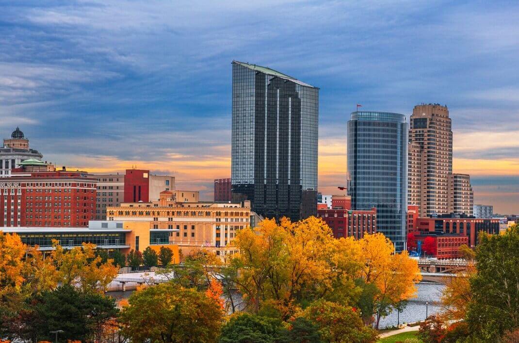 Grand Rapids, Michigan, in the fall with trees and skyscrapers.